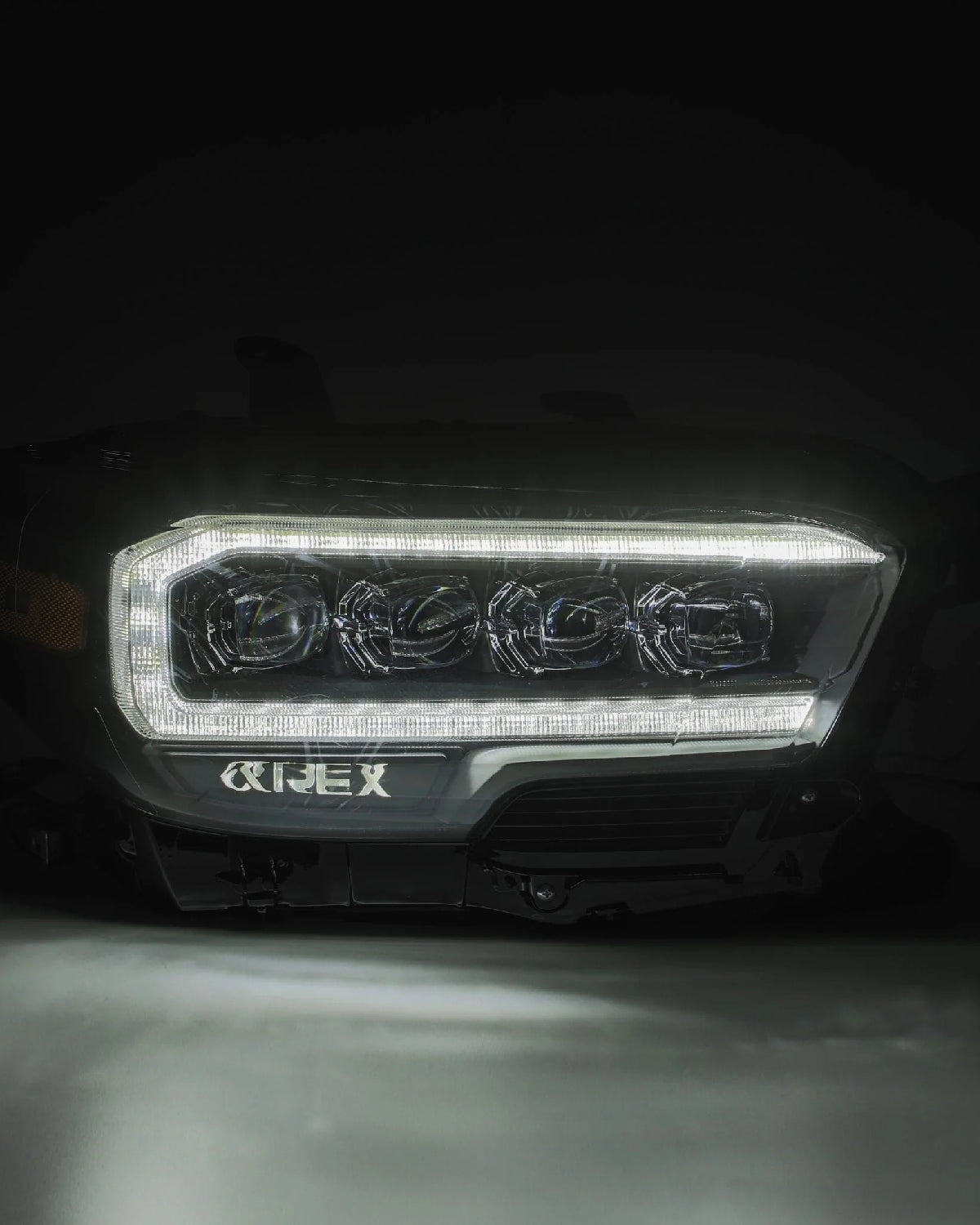 AlphaRex Nova-Series Sequential LED Projector Headlights with White/Amber DRL and Black Housing for 3rd-Gen Tacoma TRD with OEM Halogen Headlights (2016–2020) - Pair