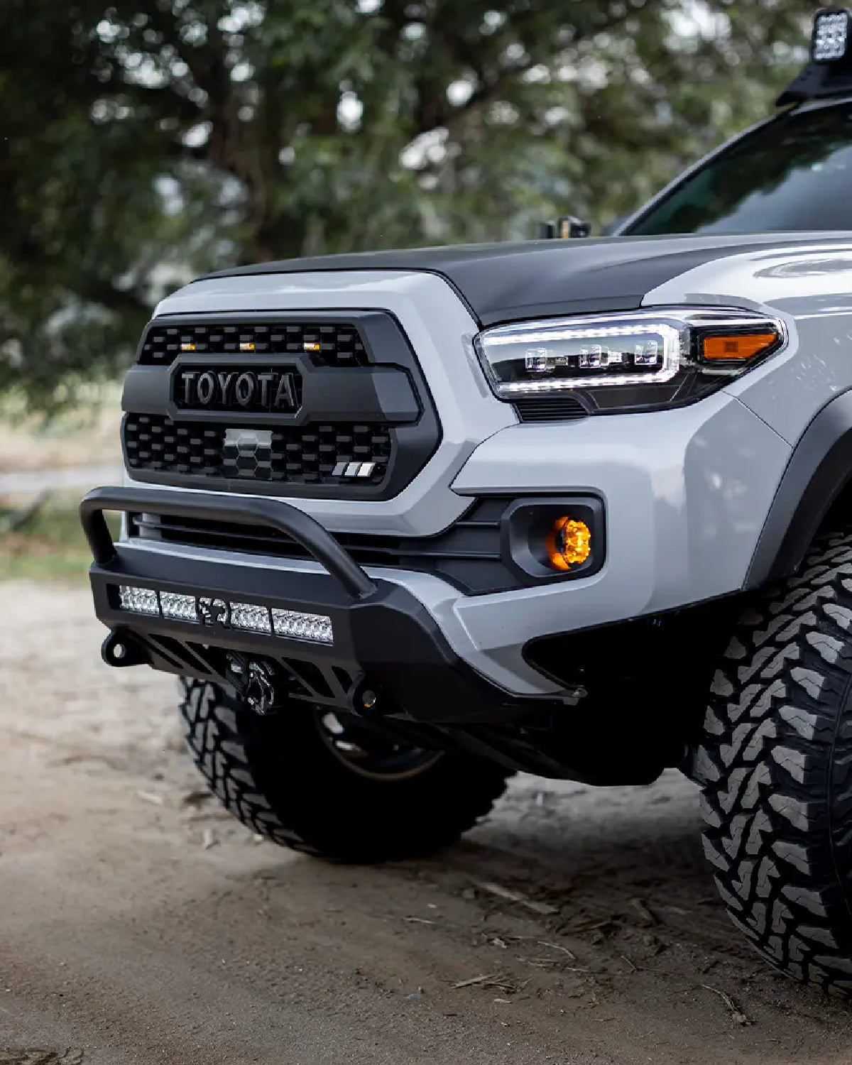 Cali Raised LED Stealth Low-Profile Front Bumper with Bull Bar, Light Bar with Spot Beam Pattern and Clear Lens, and Tall Push-Button Switch for 3rd-Gen Tacoma (2016–2023)