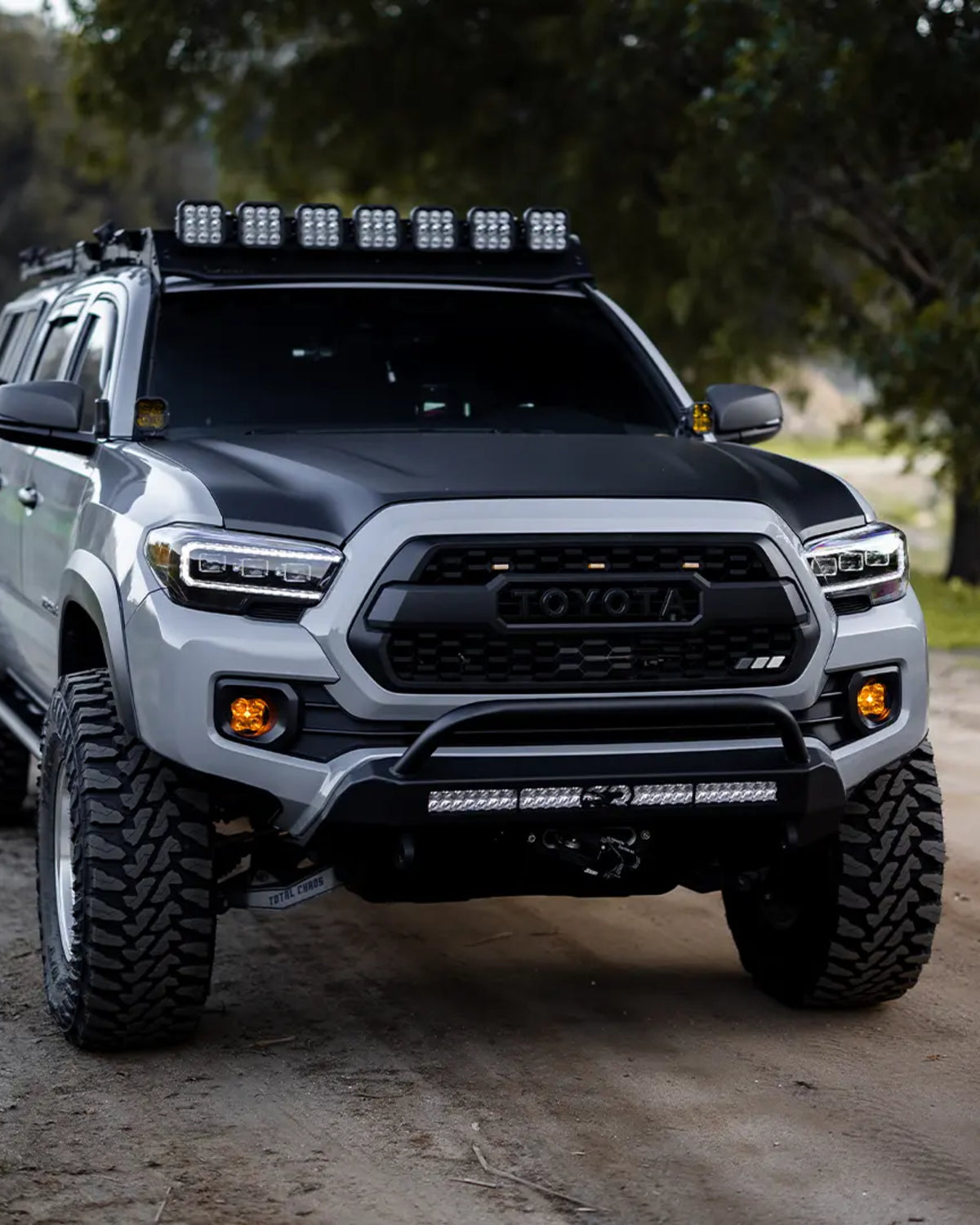 Cali Raised LED Stealth Low-Profile Front Bumper with Bull Bar, Light Bar with Spot Beam Pattern and Clear Lens, and Tall Push-Button Switch for 3rd-Gen Tacoma (2016–2023)