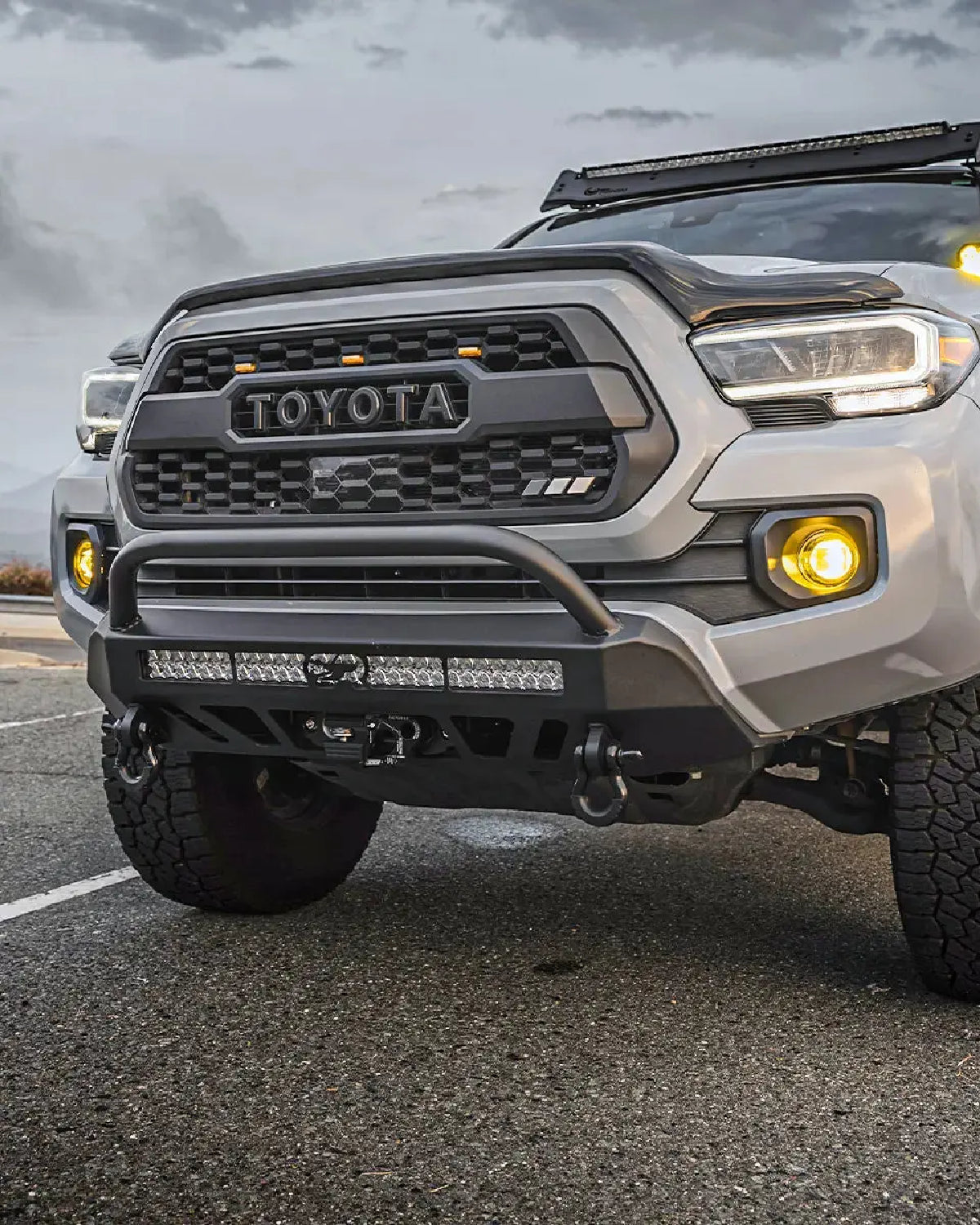 Cali Raised LED Stealth Low-Profile Front Bumper with Bull Bar and Light Bar with Spot Beam Pattern and Clear Lens for 3rd-Gen Tacoma (2016–2023)