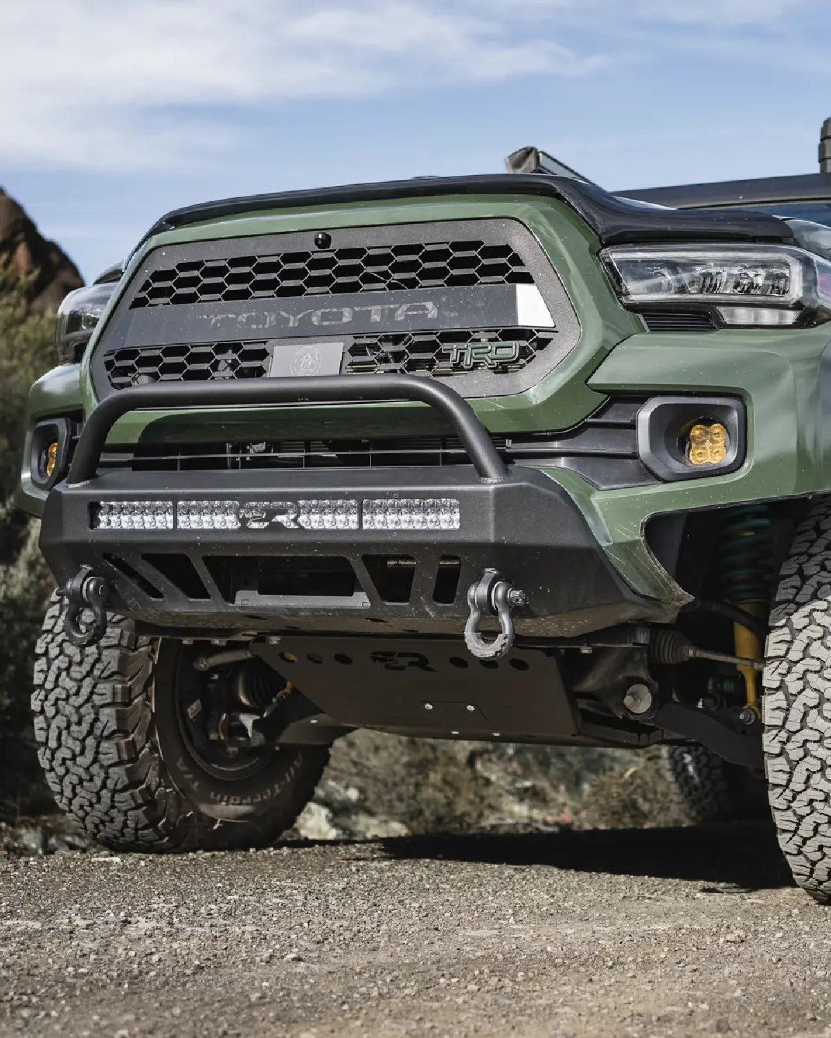 Cali Raised LED Stealth Low-Profile Front Bumper with Bull Bar, Light Bar with Spot Beam Pattern and Clear Lens, and Tall Push-Button Switch for 3rd-Gen Tacoma (2016–2023)