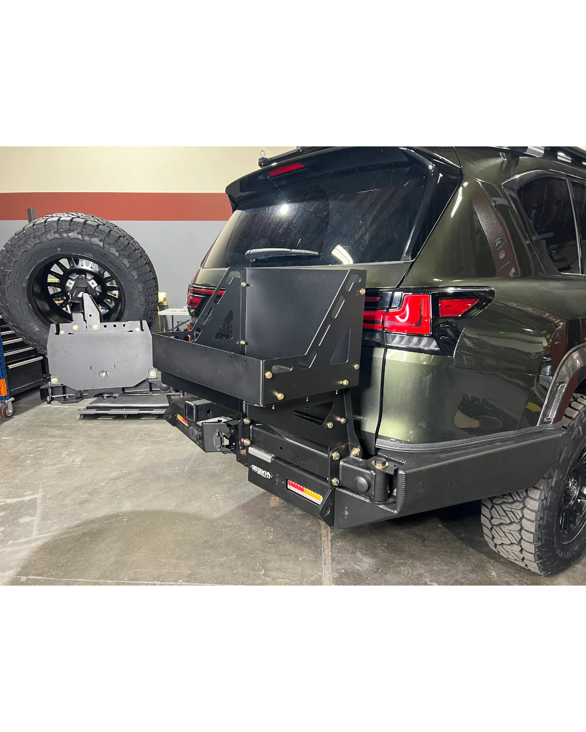 Dissent Off-Road Swing-Out Triple Jerry Can Carrier