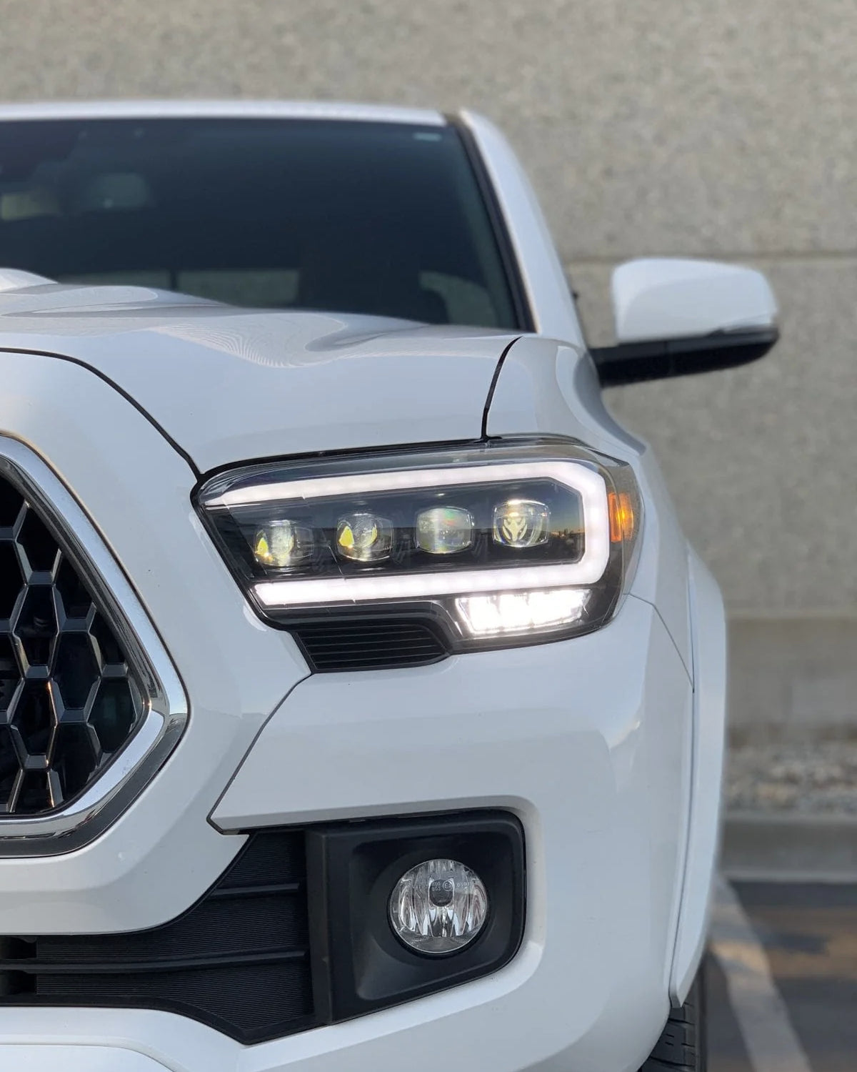 AlphaRex Nova-Series Sequential LED Projector Headlights with White/Amber DRL and Black Housing for 3rd-Gen Tacoma TRD with OEM Halogen Headlights (2016–2020) - Pair