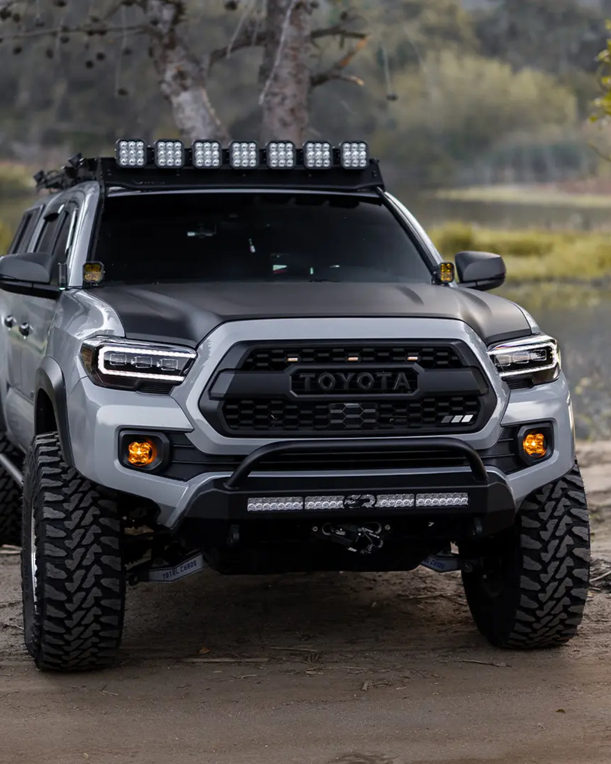 Cali Raised LED Stealth Low-Profile Front Bumper with Bull Bar, Light Bar with Spot Beam Pattern and Clear Lens, and Tall Push-Button Switch for 3rd-Gen Tacoma (2016–2023)