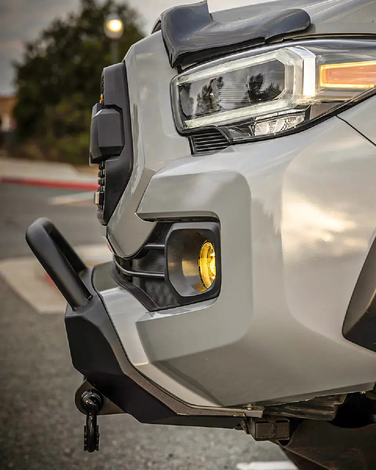 Cali Raised LED Stealth Low-Profile Front Bumper with Bull Bar, Light Bar with Spot Beam Pattern and Clear Lens, and Tall Push-Button Switch for 3rd-Gen Tacoma (2016–2023)