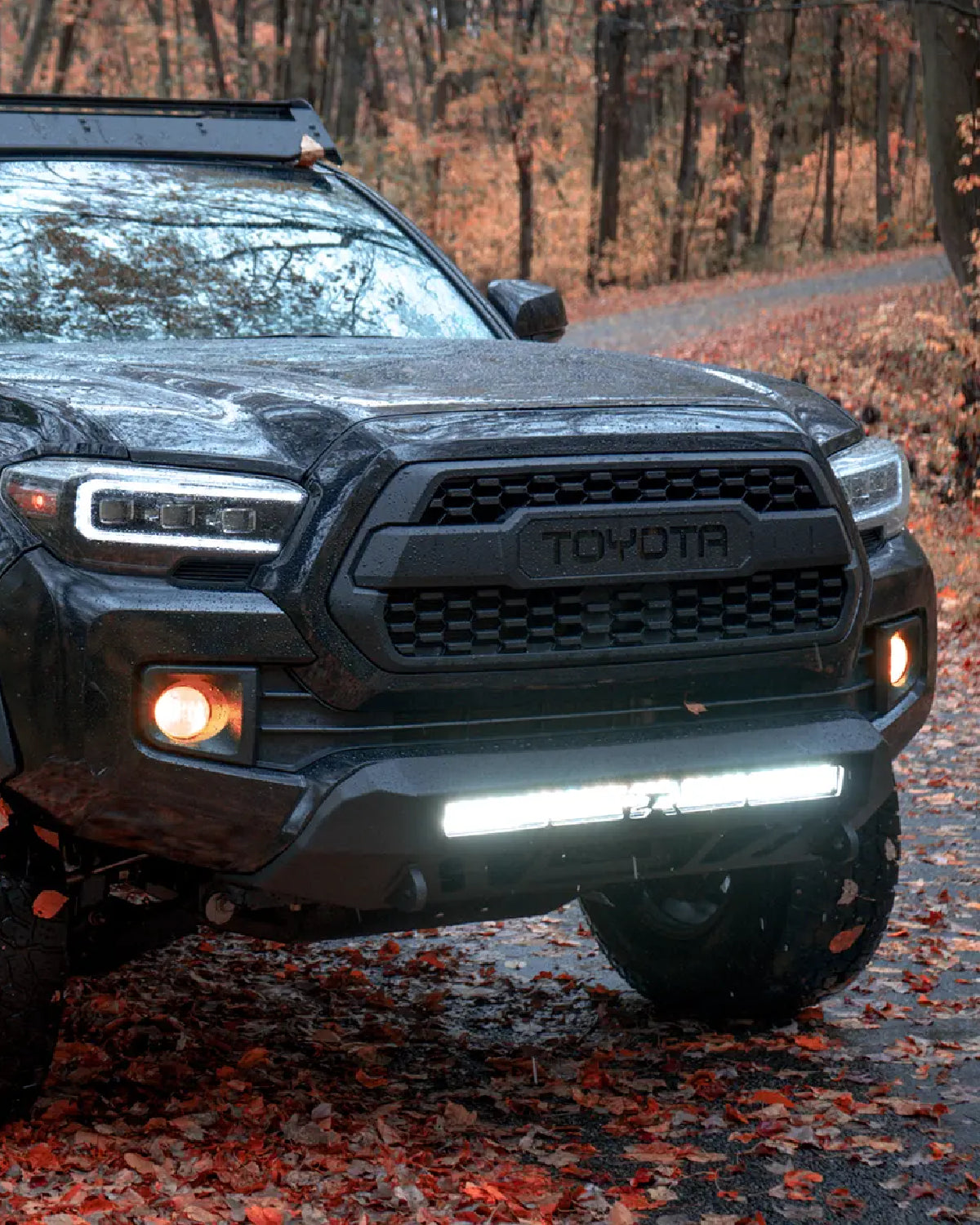 Cali Raised LED Stealth Low-Profile Front Bumper with Light Bar with Combo Beam Pattern and Clear Lens and Short Push-Button Switch for 3rd-Gen Tacoma (2016–2023)