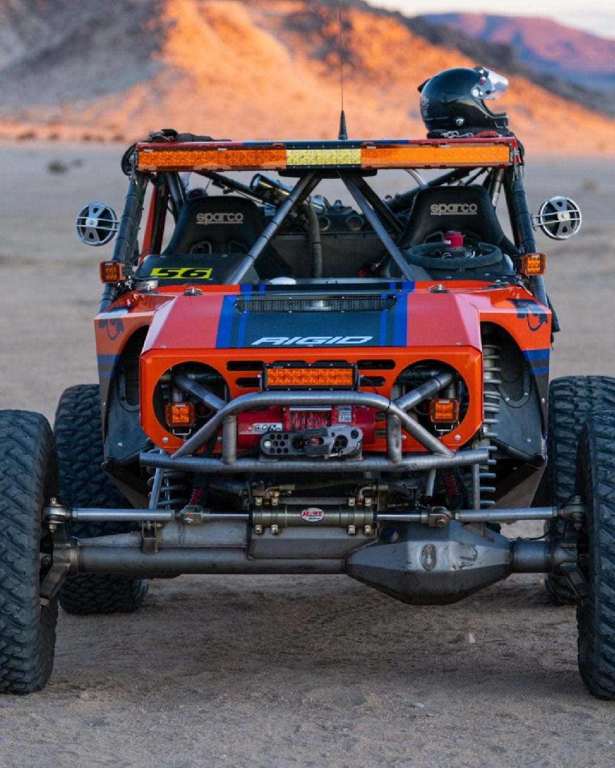 Off-road vehicle with a desert landscape in the background